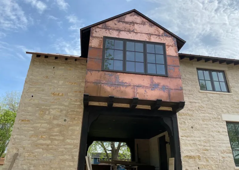 Copper metal panel facade on a stone building for Skylight Installation in Cherry Hill