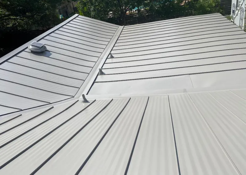Solar attic fan installed on a metal roof for Roof Ventilation in Cherry Hill